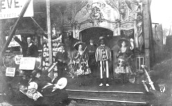Detail of show stand featuring Ben Hobson (far left), c. 1907. Courtesy of the National Fairground Archive.