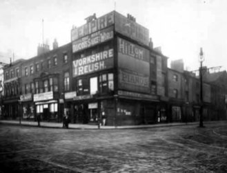 The junction of Duncan Street and Briggate, Leeds, 1902. The sign for my great-great-grandmother Emma Sillers's mailcarts shop can be seen beneath the larger sign for 'Yorkshire Relish' (via Leodis).