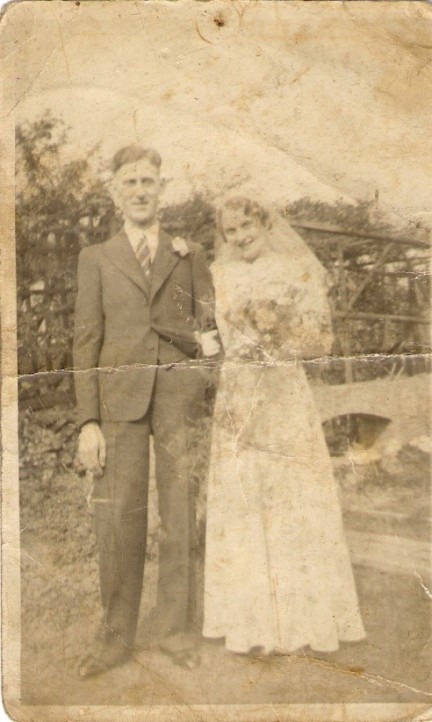 Frederick and Julia Mary England (née Mills), photographed the day of their wedding on 16 April 1938 in Fred's parents' garden at 98 Hollbrook Street, Heanor.